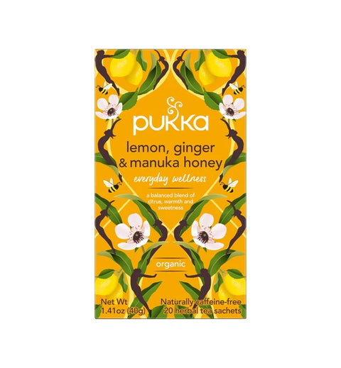 Pukka lemon, ginger and manuka honey tea packaging on a white background