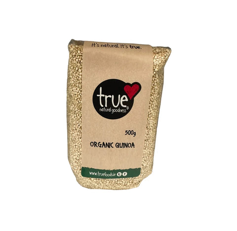 Bag of organic quinoa with 'true natural goodness' branding on a white background