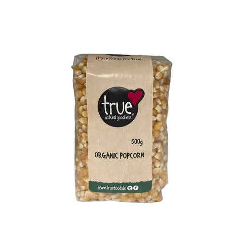 Bag of organic popcorn with 'true foodie' branding on a white background