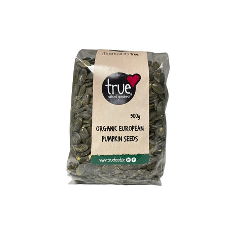 Bag of organic European pumpkin seeds with 'true food' label on a white background